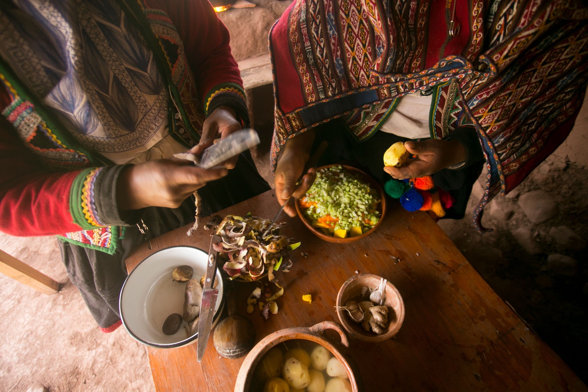 Cooking a traditional Andean vegetable soup before a Pachamanca feast with a Quechua tribe in the Sacred Valley, Peru.