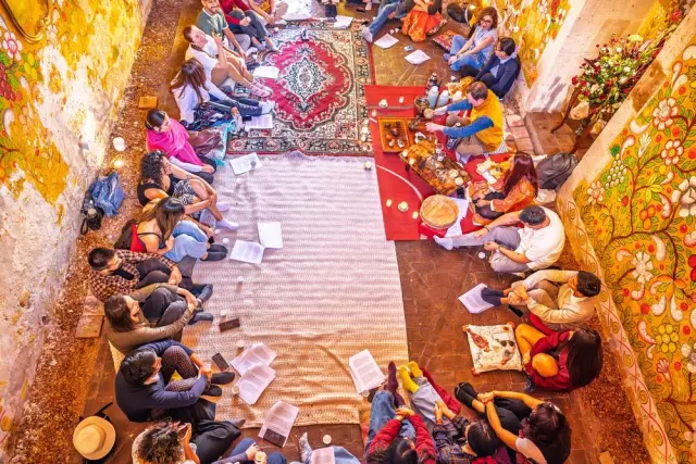 Guests around the rug at a ceremony, seen from above